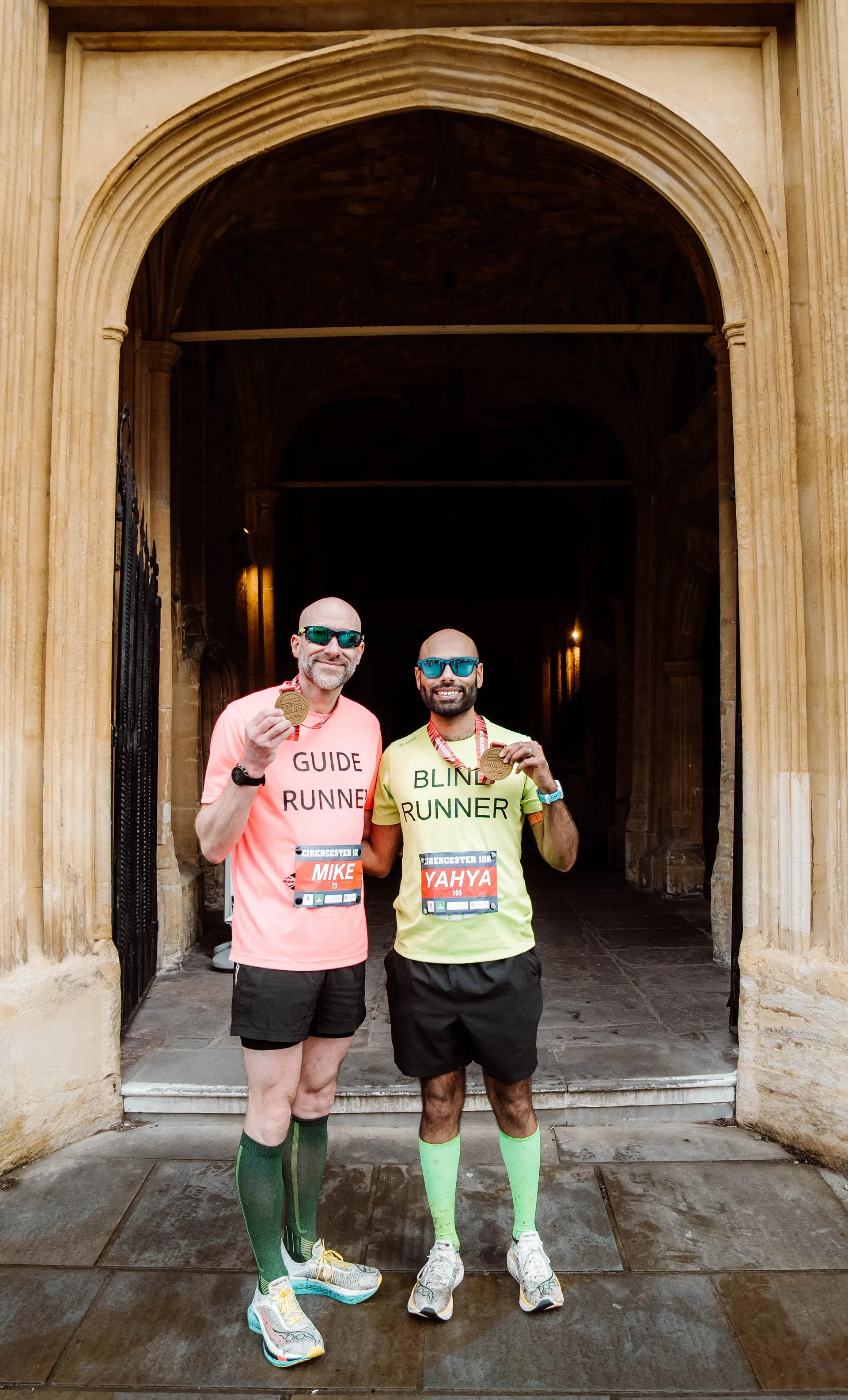 Runners together outside the church in Cirencester