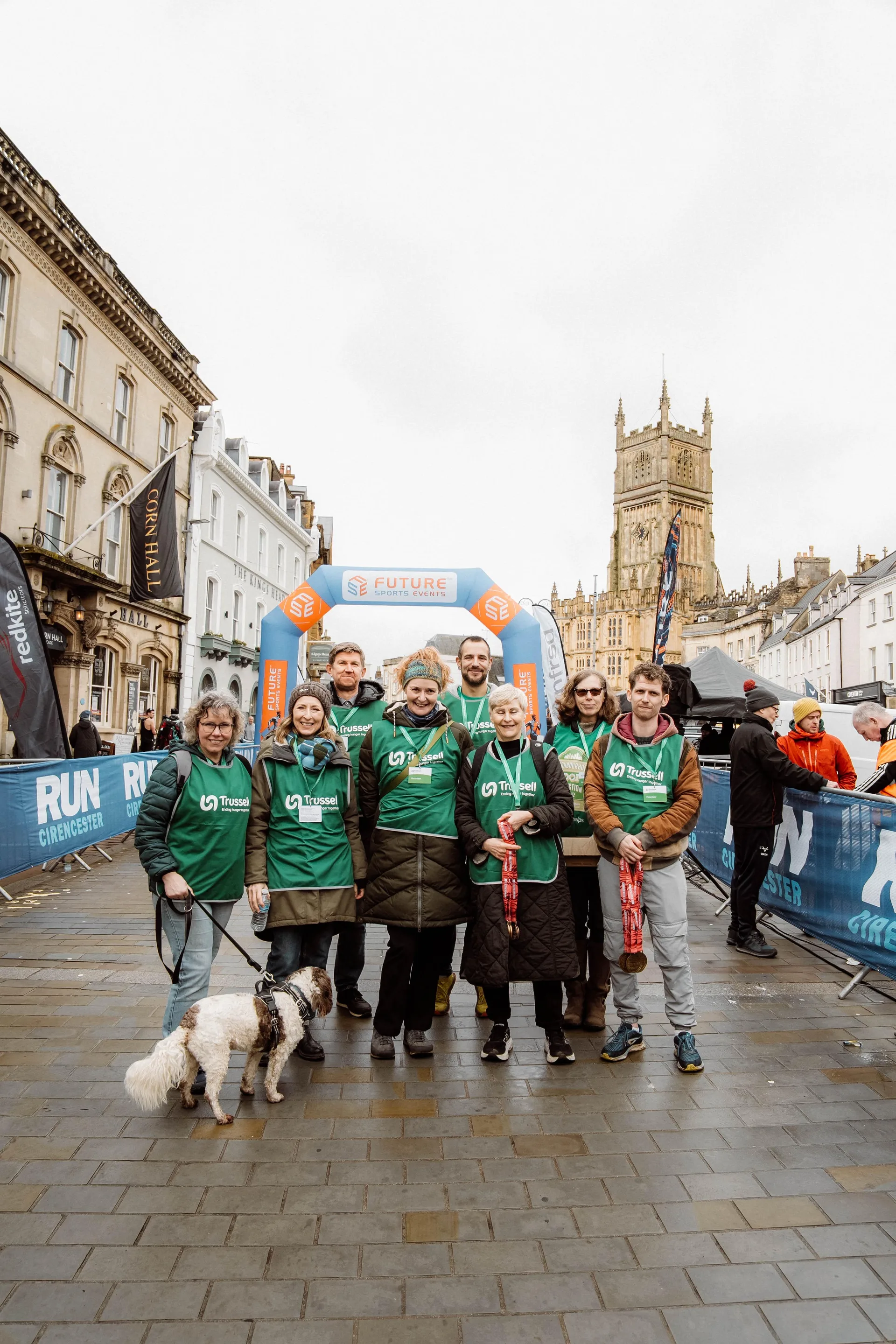 A group gathering beside the Cirencester race barriers