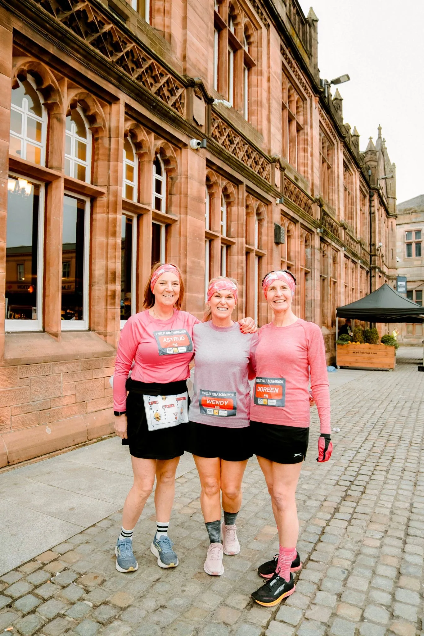 Three runners together on race day in Paisley